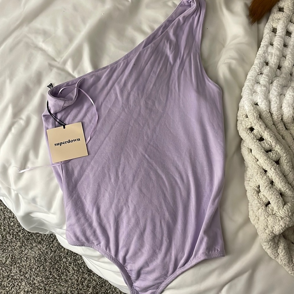 Revolve body suit never worn still with tags. Size SMALL